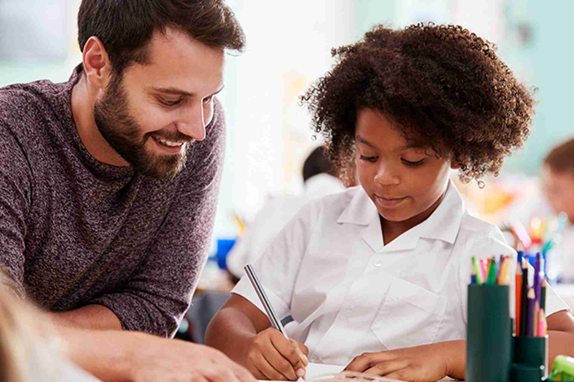 Educator reviewing student reading assessment data and dyslexia screening results to identify early signs of reading difficulties.